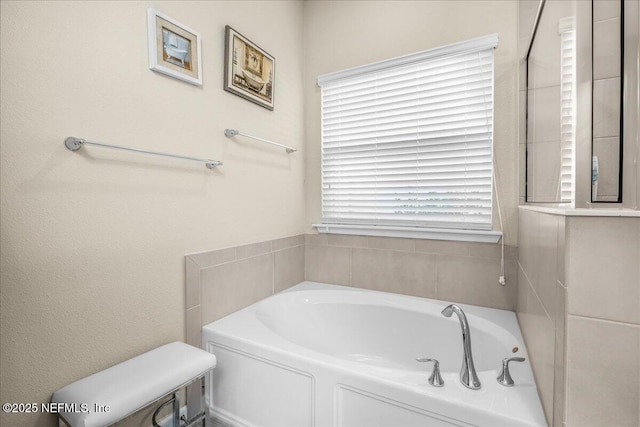 bathroom featuring a tub to relax in