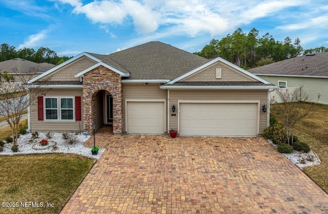 view of front of property with a garage