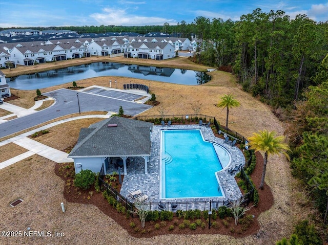 view of swimming pool with a water view