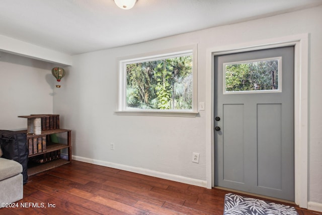 foyer with hardwood / wood-style flooring and baseboards