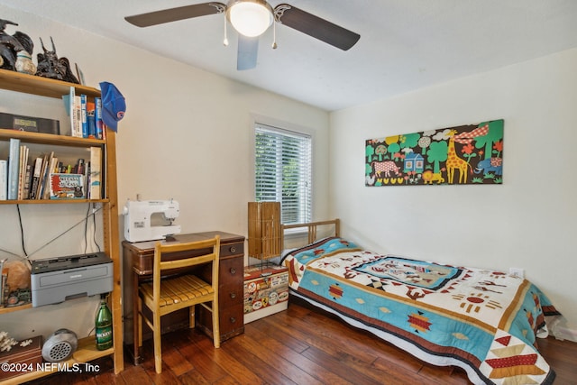 bedroom featuring ceiling fan and dark wood-type flooring