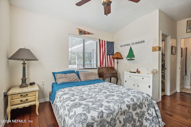 bedroom featuring ceiling fan, lofted ceiling, and dark wood-type flooring