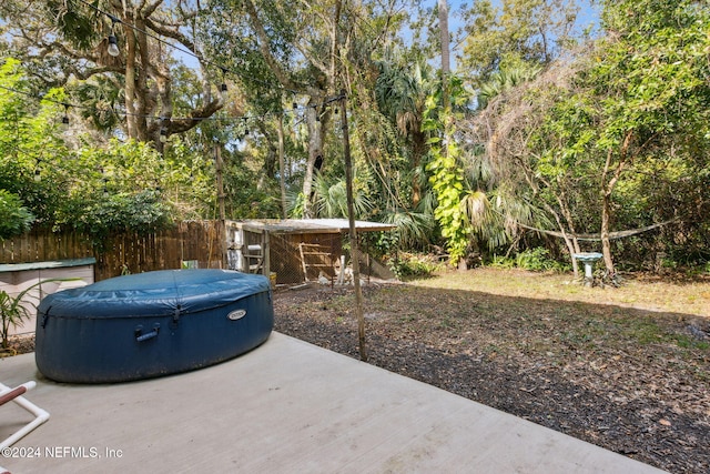 view of patio / terrace featuring a hot tub