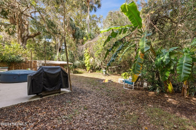 view of yard with a patio and fence