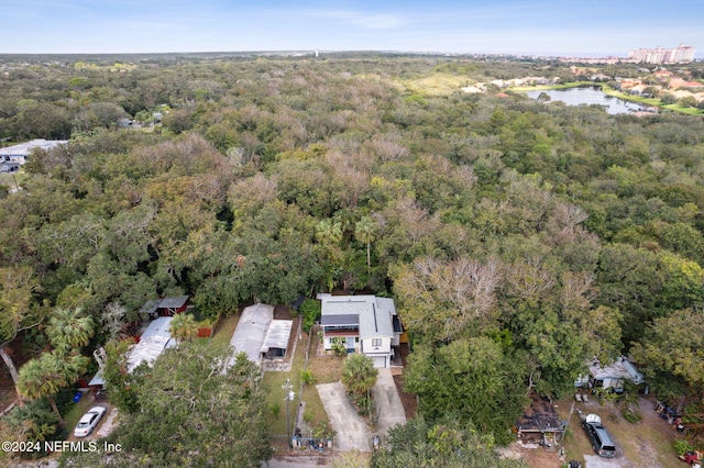 aerial view with a view of trees and a water view