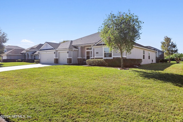 ranch-style house featuring a front lawn and a garage