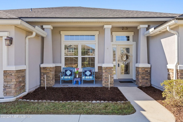 doorway to property featuring covered porch