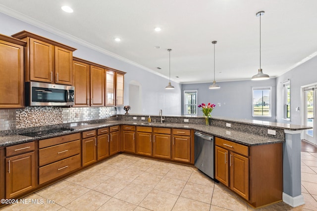 kitchen featuring crown molding, sink, pendant lighting, and appliances with stainless steel finishes