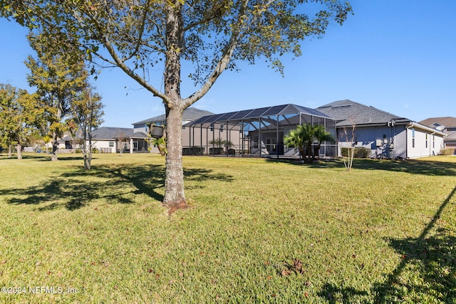 view of yard featuring glass enclosure