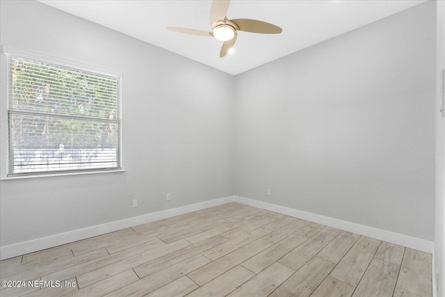 empty room featuring ceiling fan and light wood-type flooring