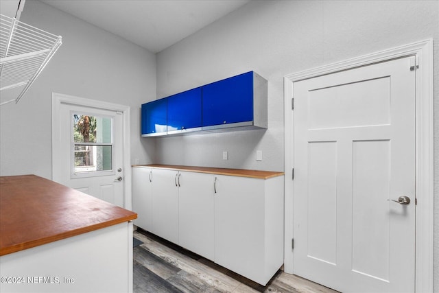 kitchen with white cabinetry and light wood-type flooring