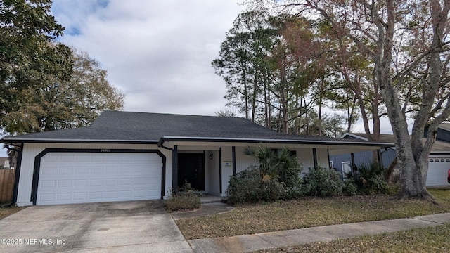 ranch-style house featuring a garage