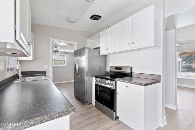 kitchen featuring white cabinetry, a wealth of natural light, and appliances with stainless steel finishes