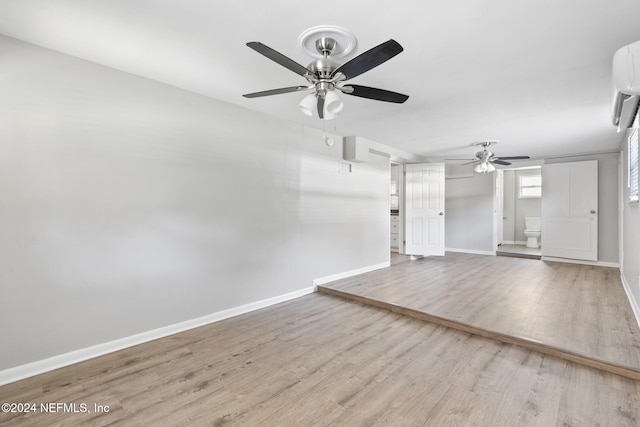 unfurnished living room featuring light wood-type flooring and ceiling fan