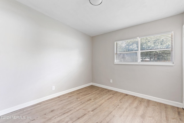 spare room featuring light wood-type flooring