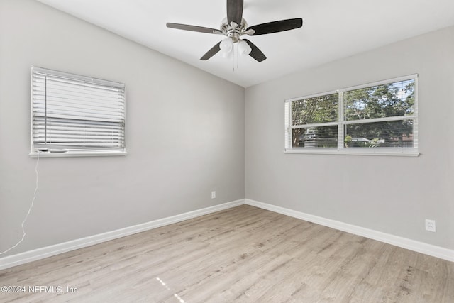 unfurnished room featuring ceiling fan and light wood-type flooring