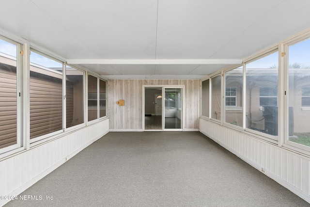 unfurnished sunroom featuring a wealth of natural light