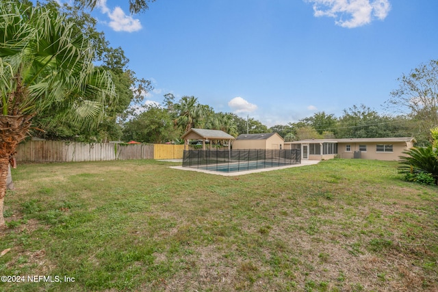 view of yard with a fenced in pool and a patio area