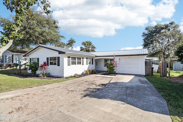 ranch-style house with a front yard and a garage