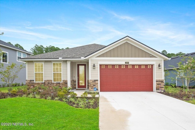 craftsman-style house with a garage and a front lawn