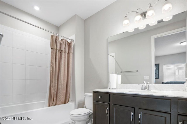 full bathroom with toilet, vanity, and shower / bath combination with curtain