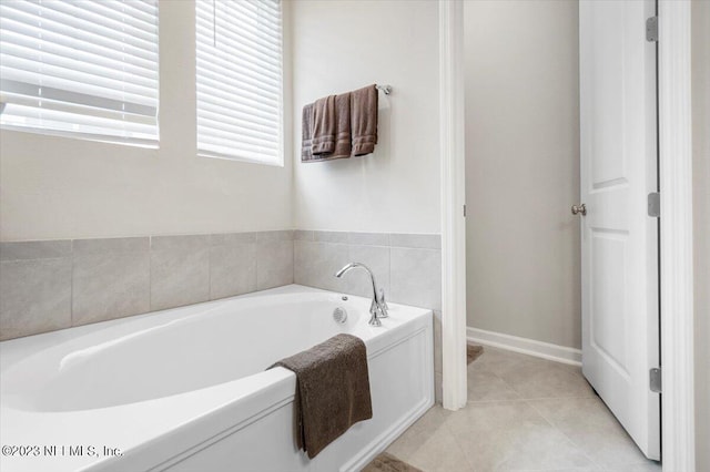 bathroom featuring a tub to relax in and tile patterned floors