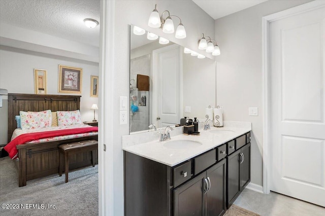 bathroom featuring vanity and a textured ceiling