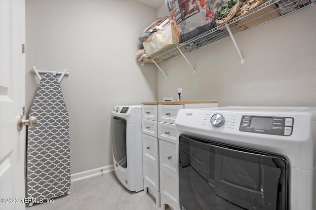 laundry room featuring washer and clothes dryer