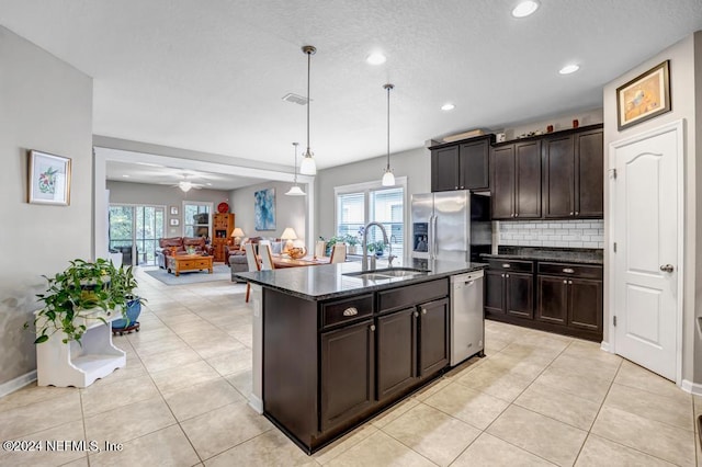 130 Wayfare Ln, Jacksonville, FL 32081 - kitchen with a sink, stainless steel appliances, dark stone counters, plenty of natural light, and recessed lighting