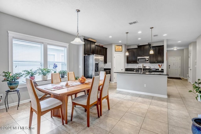 130 Wayfare Ln, Jacksonville, FL 32081 - dining space featuring recessed lighting, light tile patterned floors, and baseboards