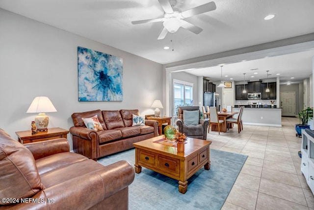 tiled living room featuring ceiling fan