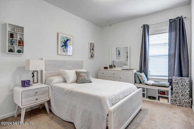 bedroom with light colored carpet