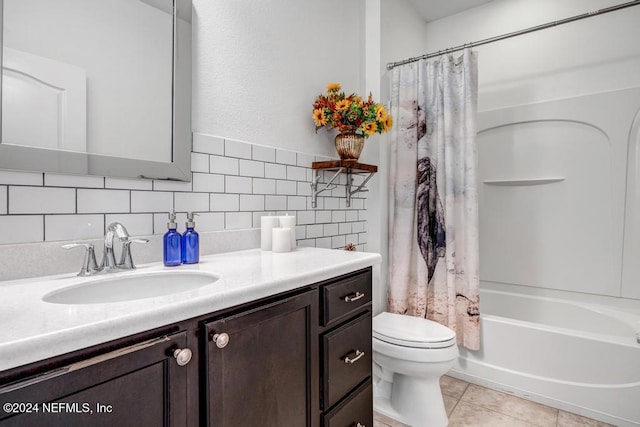 full bathroom with tile patterned flooring, toilet, decorative backsplash, shower / bath combo with shower curtain, and vanity