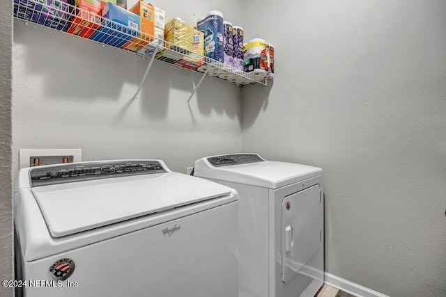 laundry area with washing machine and dryer