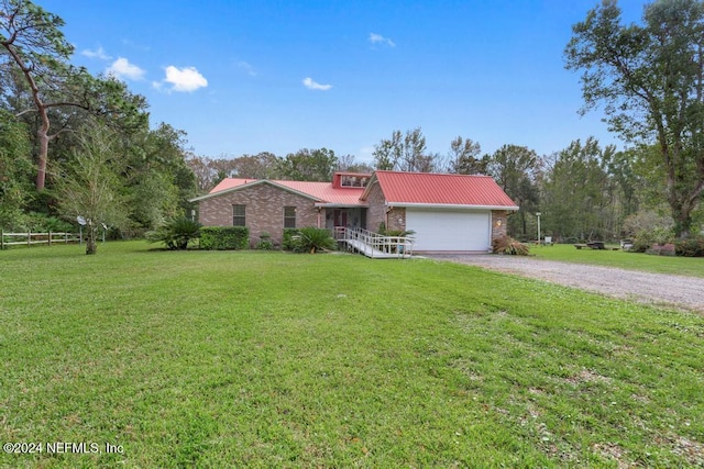 single story home featuring a front yard and a garage