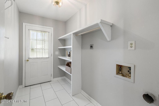 clothes washing area featuring hookup for a washing machine, light tile patterned floors, and electric dryer hookup