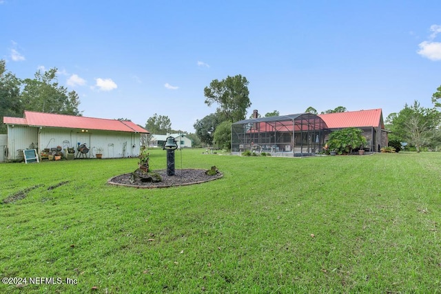 view of yard with a lanai