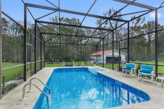 view of pool with a lawn, glass enclosure, and a patio area