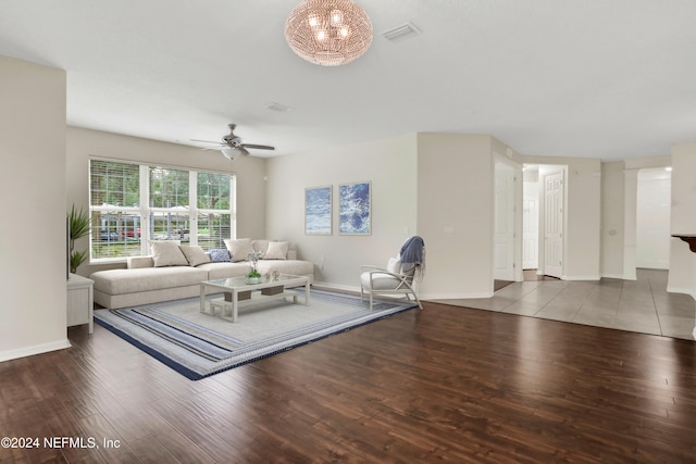 living room featuring ceiling fan and wood-type flooring