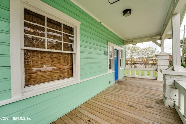 wooden terrace featuring a porch