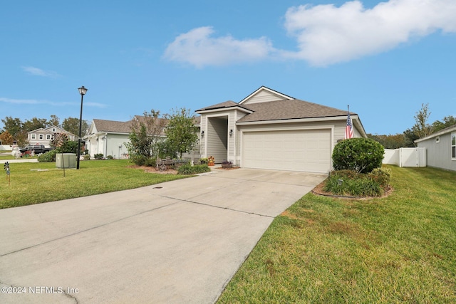 ranch-style house with a front yard and a garage