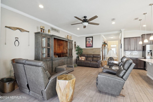 living room featuring light hardwood / wood-style floors, ceiling fan, and ornamental molding