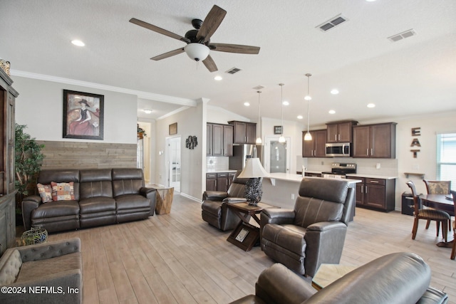 living room with ceiling fan, vaulted ceiling, ornamental molding, and light hardwood / wood-style flooring