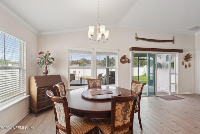 dining area featuring a chandelier, light hardwood / wood-style flooring, plenty of natural light, and ornamental molding