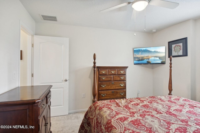 bedroom with light carpet and ceiling fan