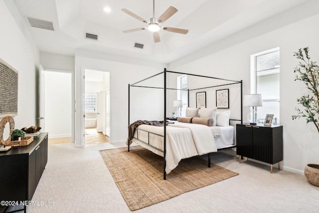 carpeted bedroom featuring connected bathroom and ceiling fan