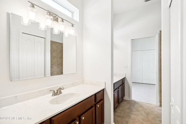 bathroom with vanity and tile patterned flooring