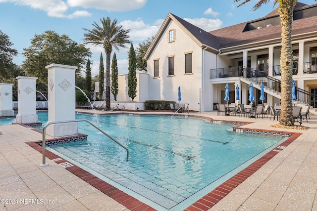 view of swimming pool with a patio area