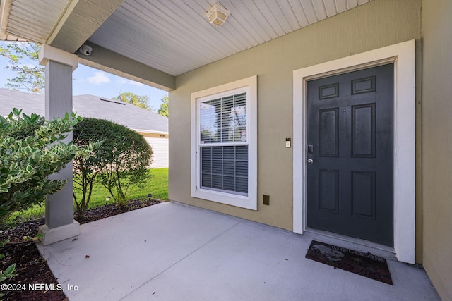 doorway to property featuring a patio