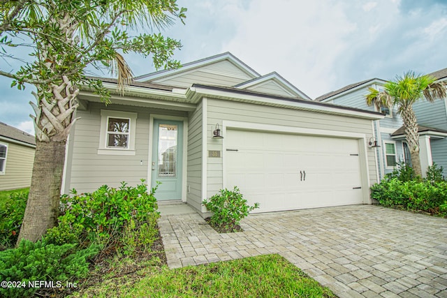 single story home with a garage